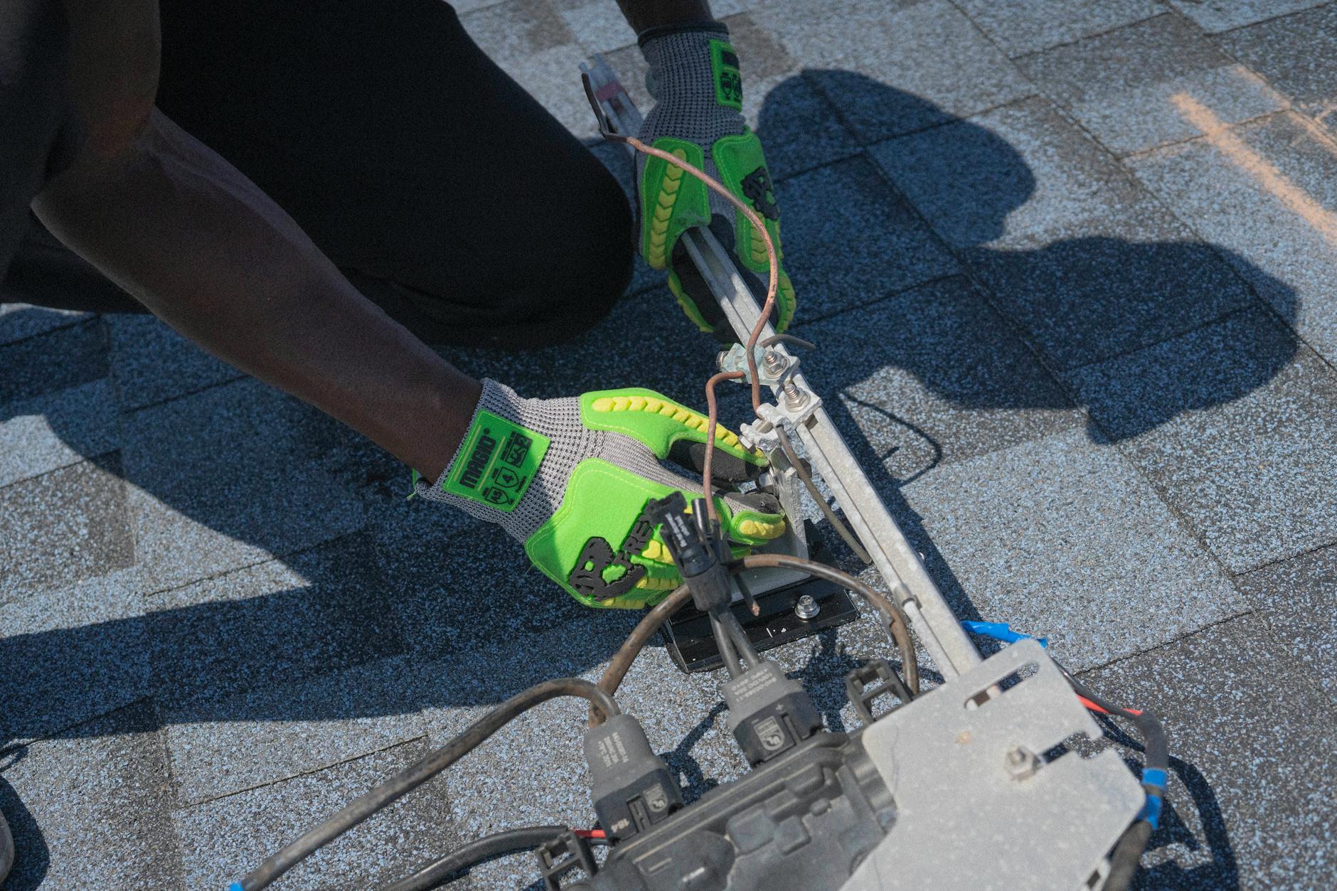 A professional roofing technician inspecting a concrete tile roof on a Henderson home, ensuring compliance with local codes.